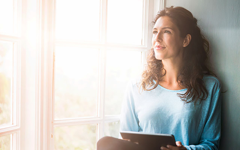 Woman Sitting by Window